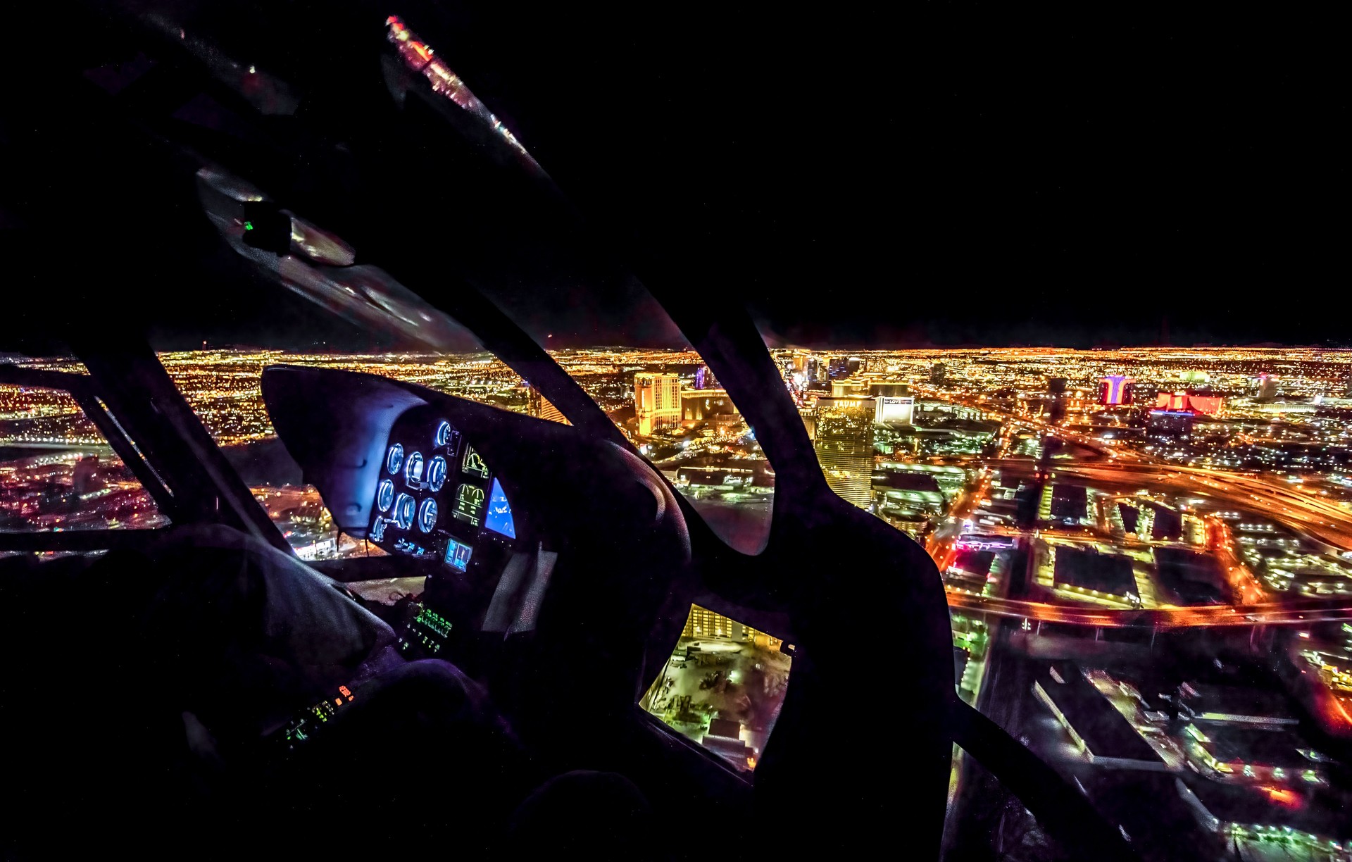 Scenic helicopter flight city night
